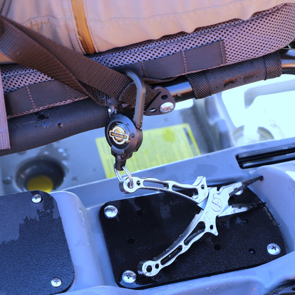 Pliers clipped securely on YakAttack retractor during fishing