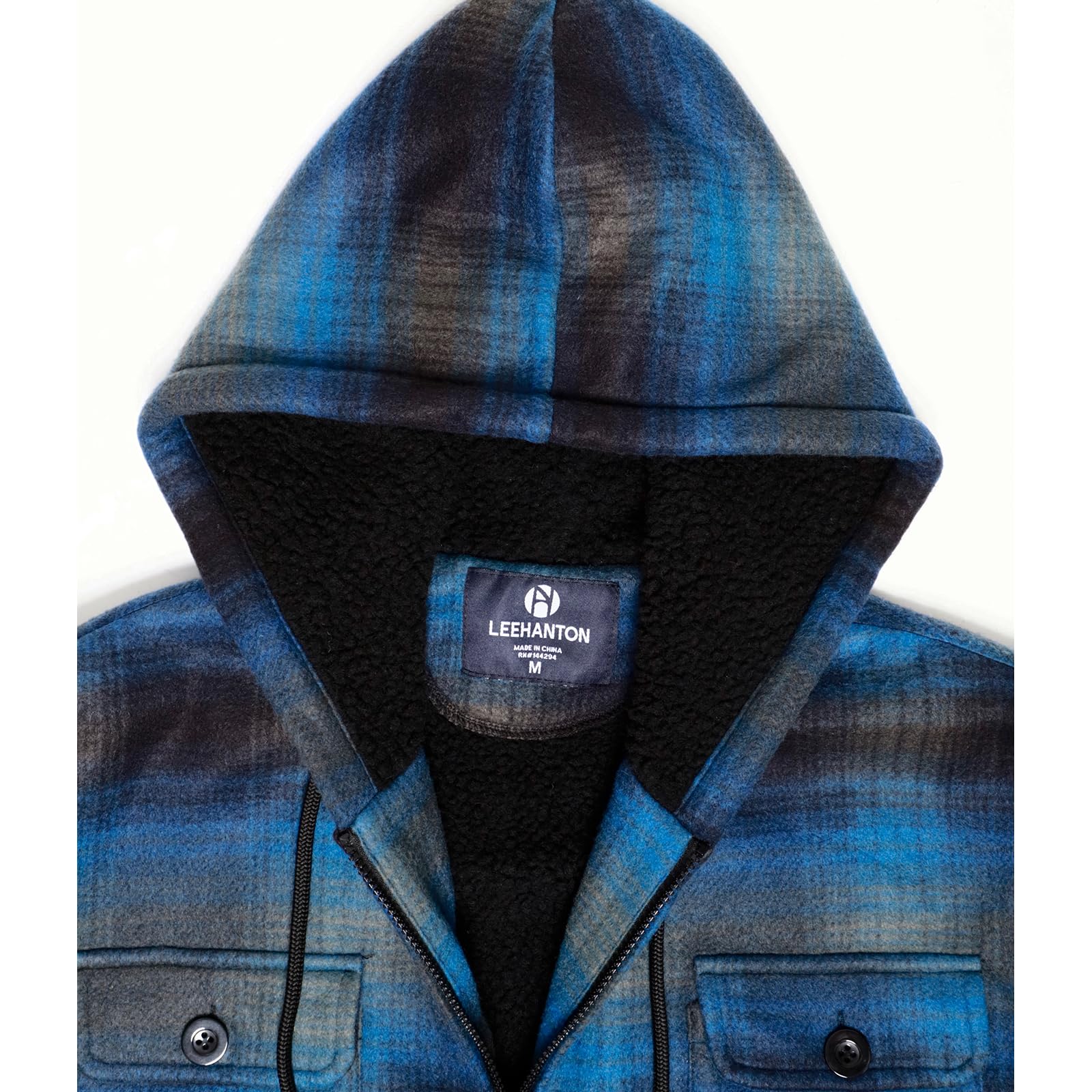 Yasumond hood with pockets side view demonstrates practical warmth storage
