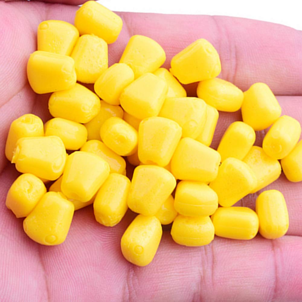 Close-up of 1 cm long yellow silicone corn baits for carp fishing
