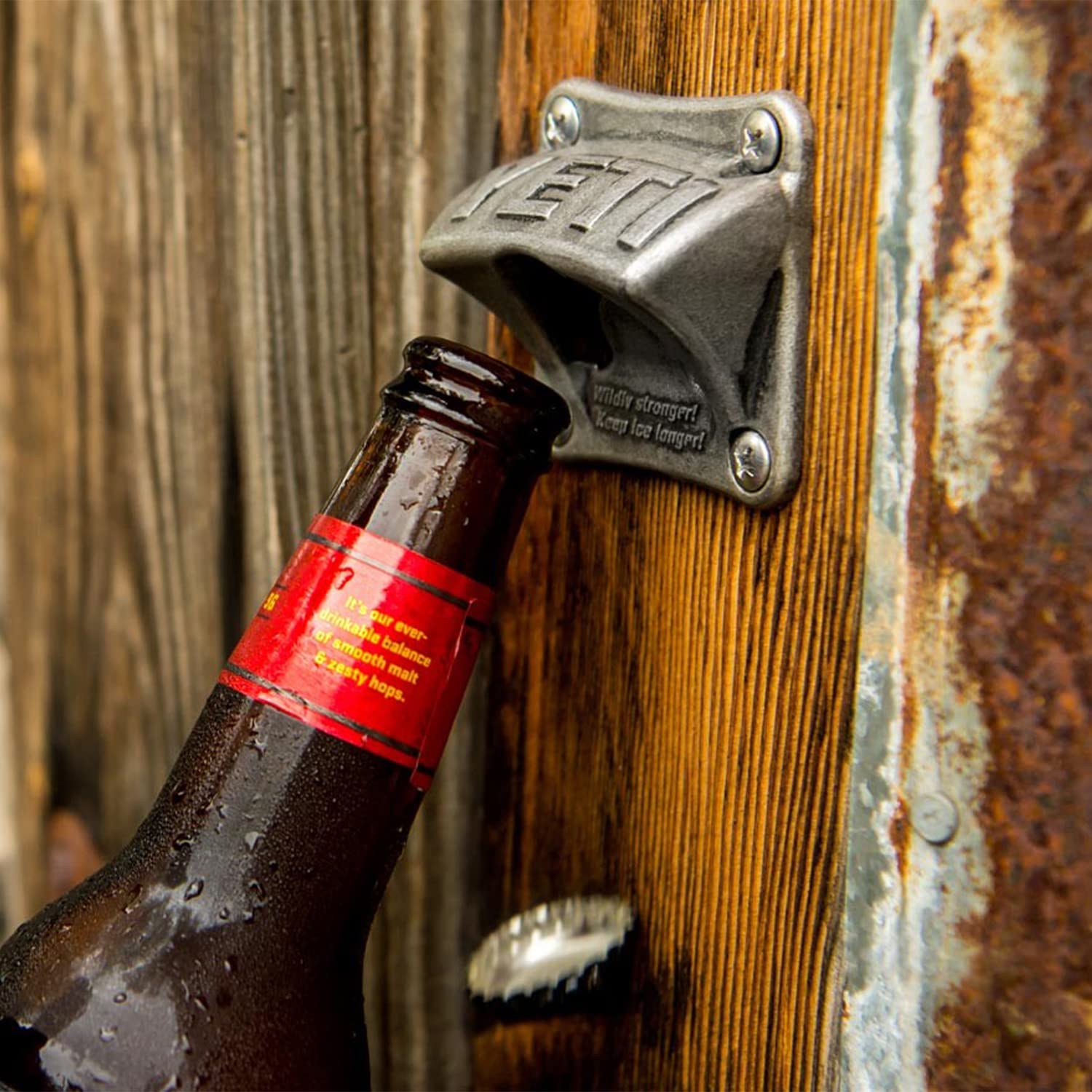 YETI bottle opener mounted near boat dock for waterfront gatherings.