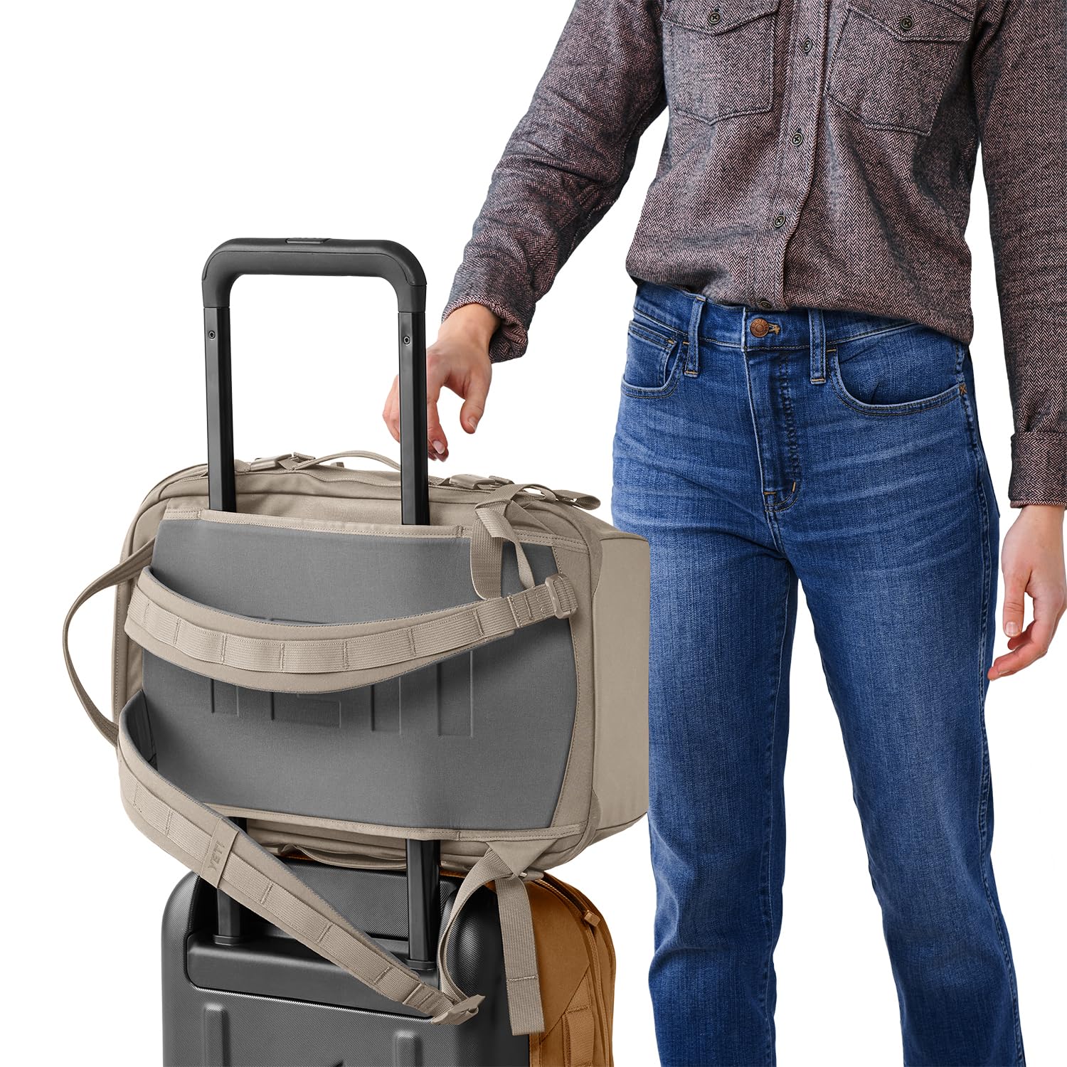 YETI Crossroads 22L in Cape Dark Taupe shown in urban setting.