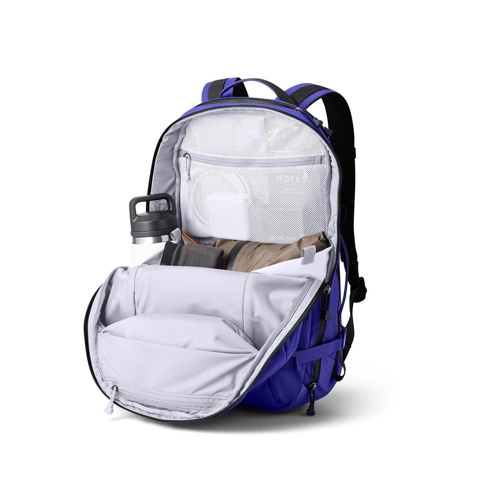 YETI Crossroads 27L luggage pass-through sleeve allows secure travel with rolling luggage.
