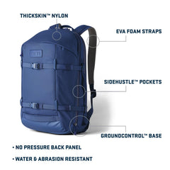 YETI Crossroads 27L backpack side pocket ultramarine violet supports quick-access hydration or snacks.