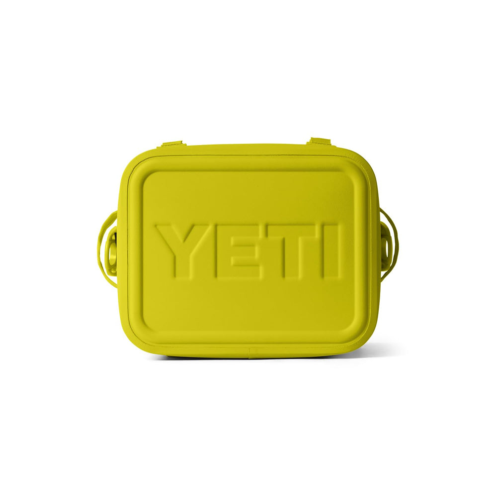 YETI Hopper Flip 12 Firefly Yellow in wild setting highlights outdoor versatility.