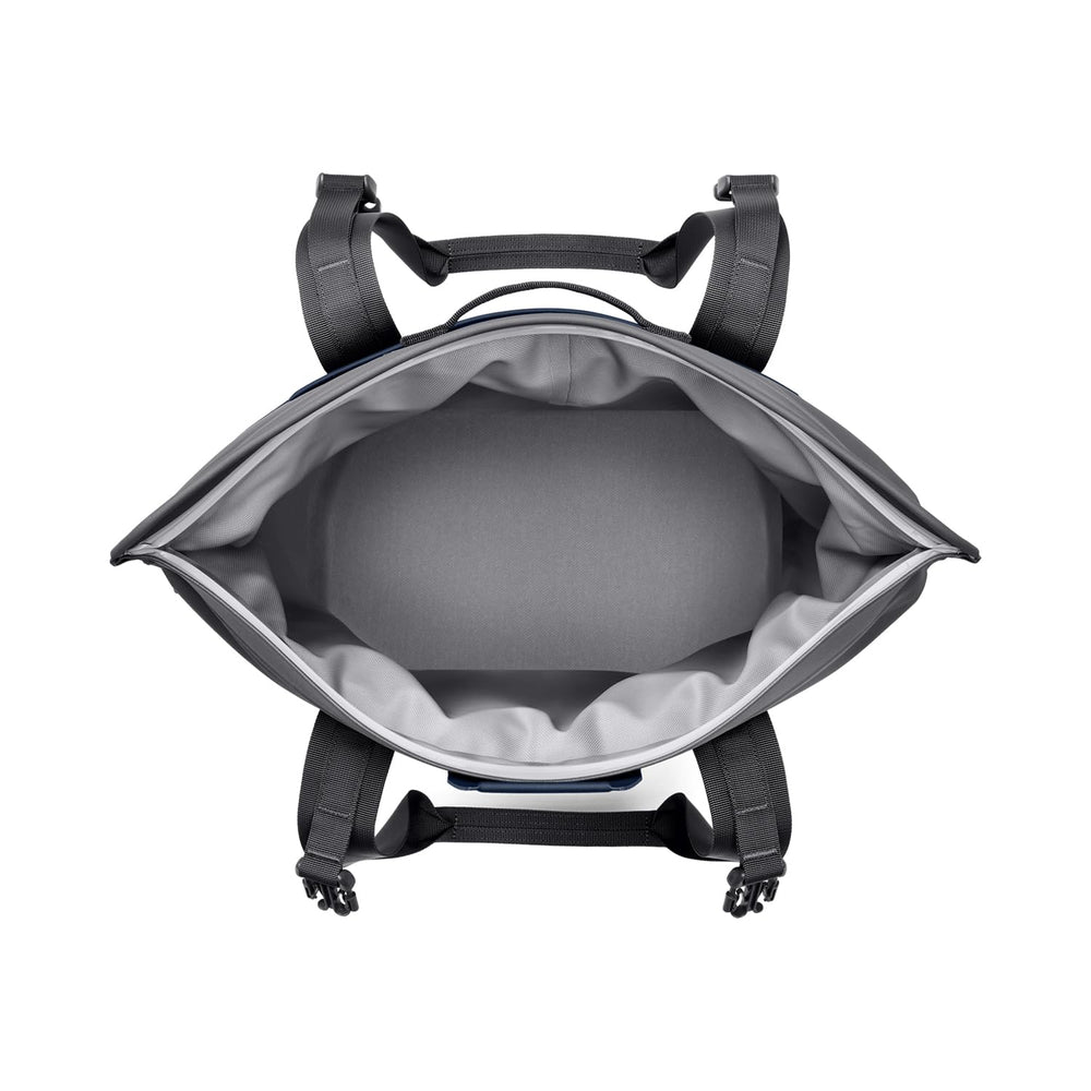 YETI Hopper M15 Navy side view on outdoor surface