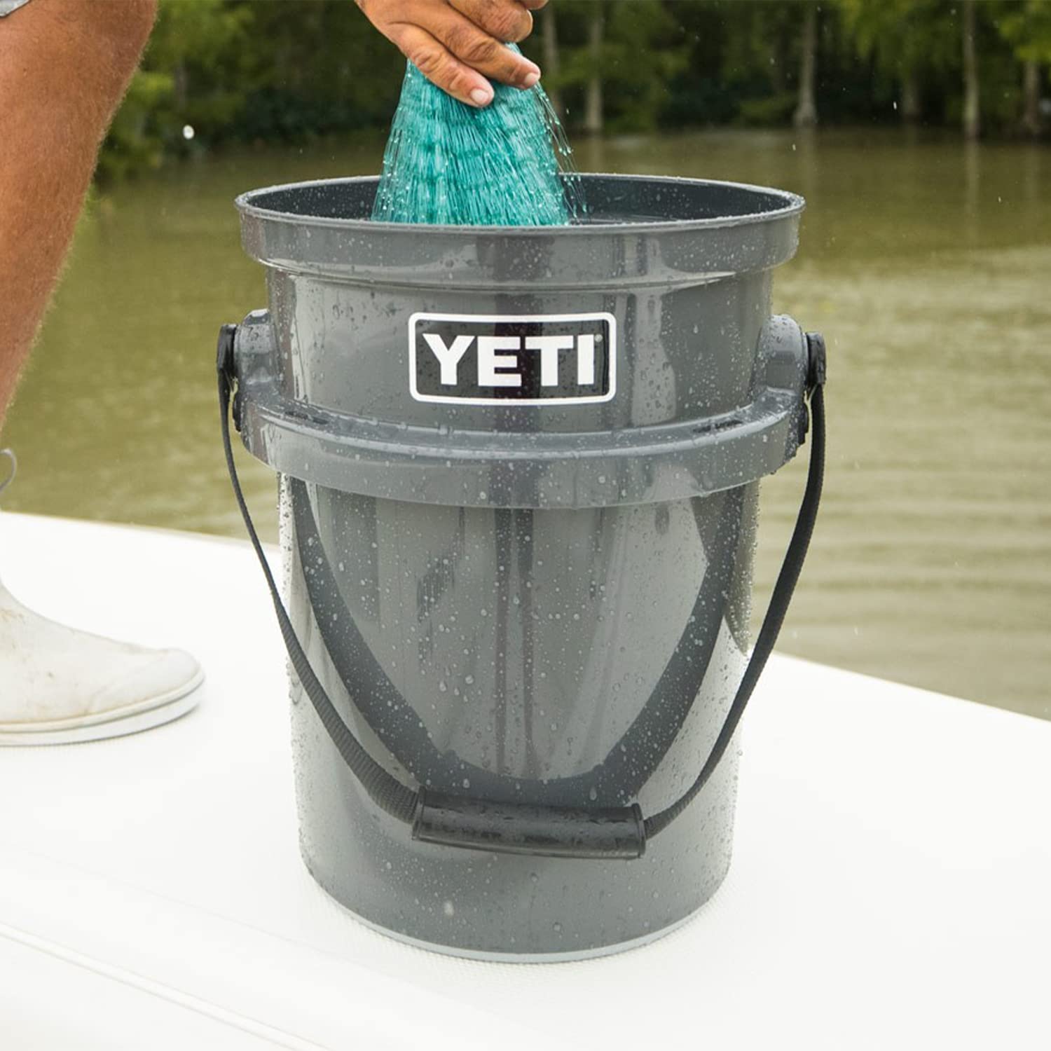 YETI LoadOut bucket in ranch setting for feed or gear.