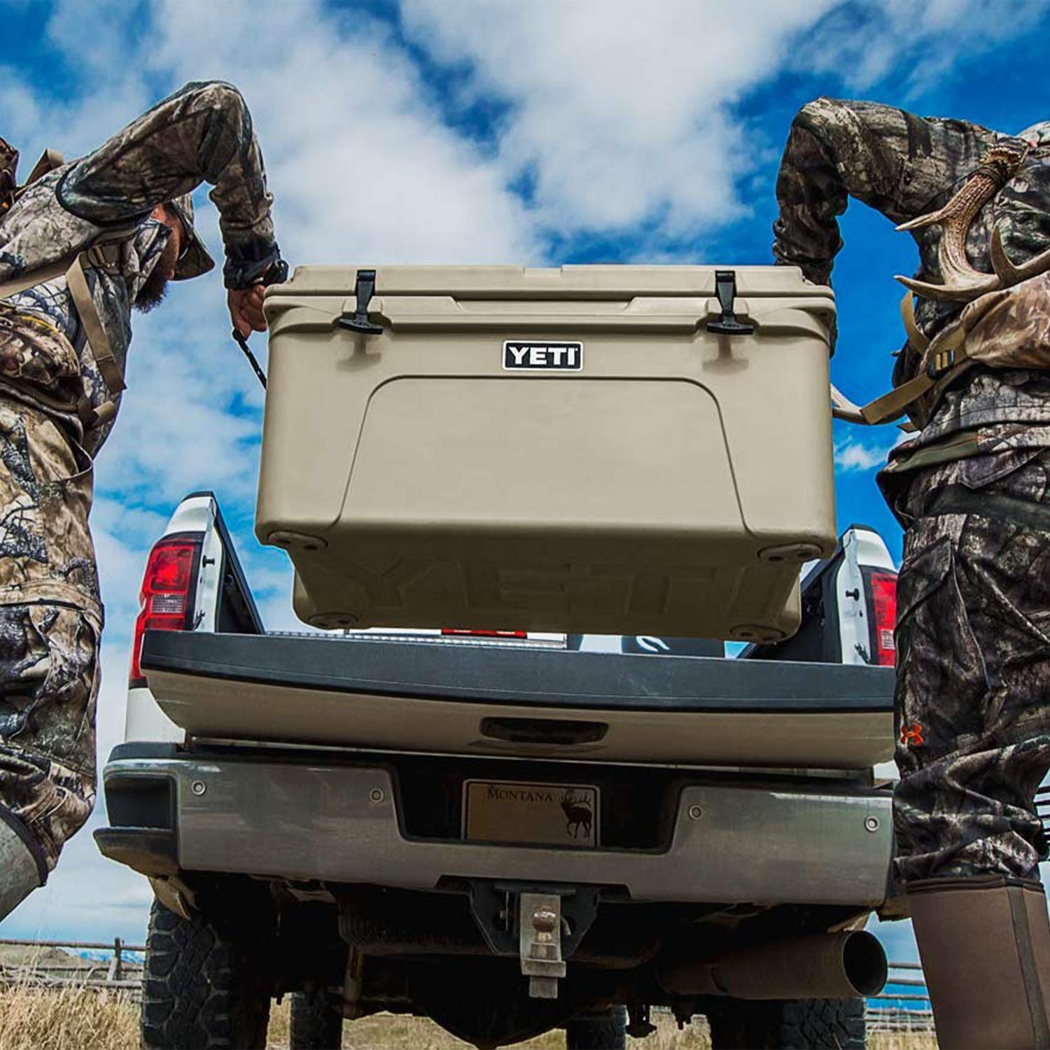 YETI Tundra 65 Desert Tan anchor-point slots enable secure mounting on vehicles.