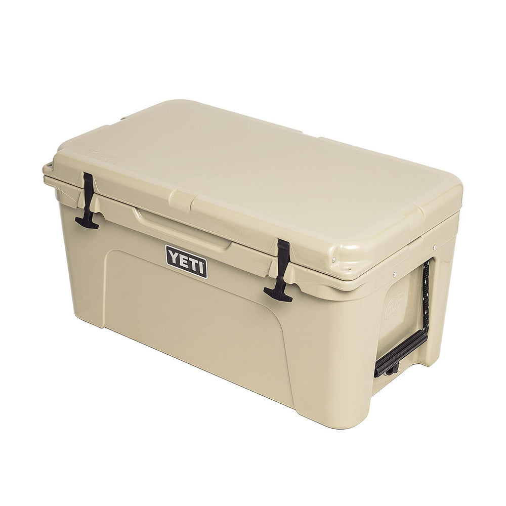 Rotomolded YETI Tundra 65 Desert Tan body emphasizes rugged durability for outdoor journeys.