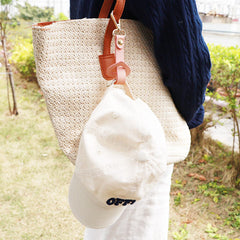 YEZILUU travel hat clip shown clipped to a bag for easy access