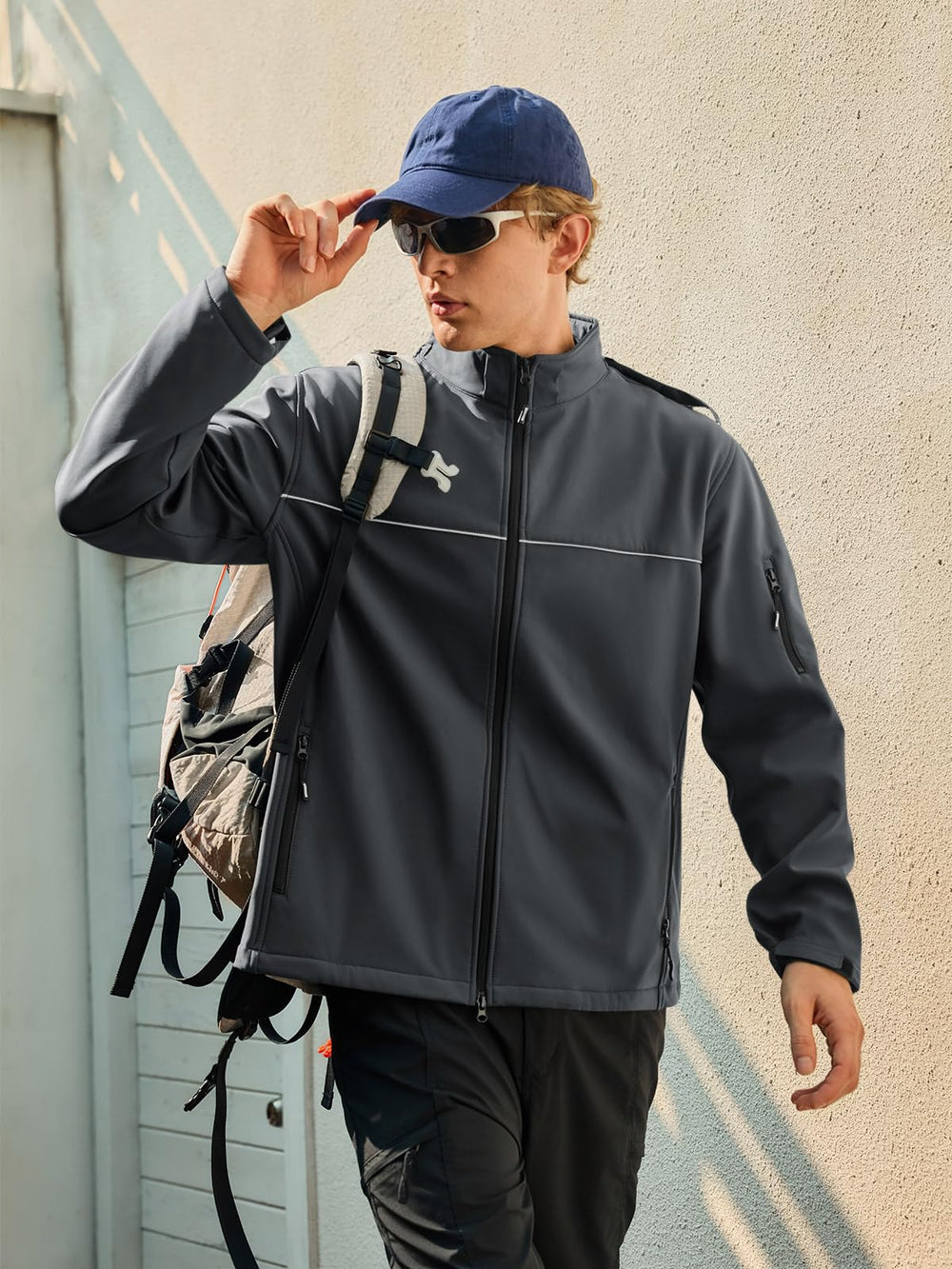 Yousify men's softshell jacket with adjustable cuffs and hem for snug warmth.