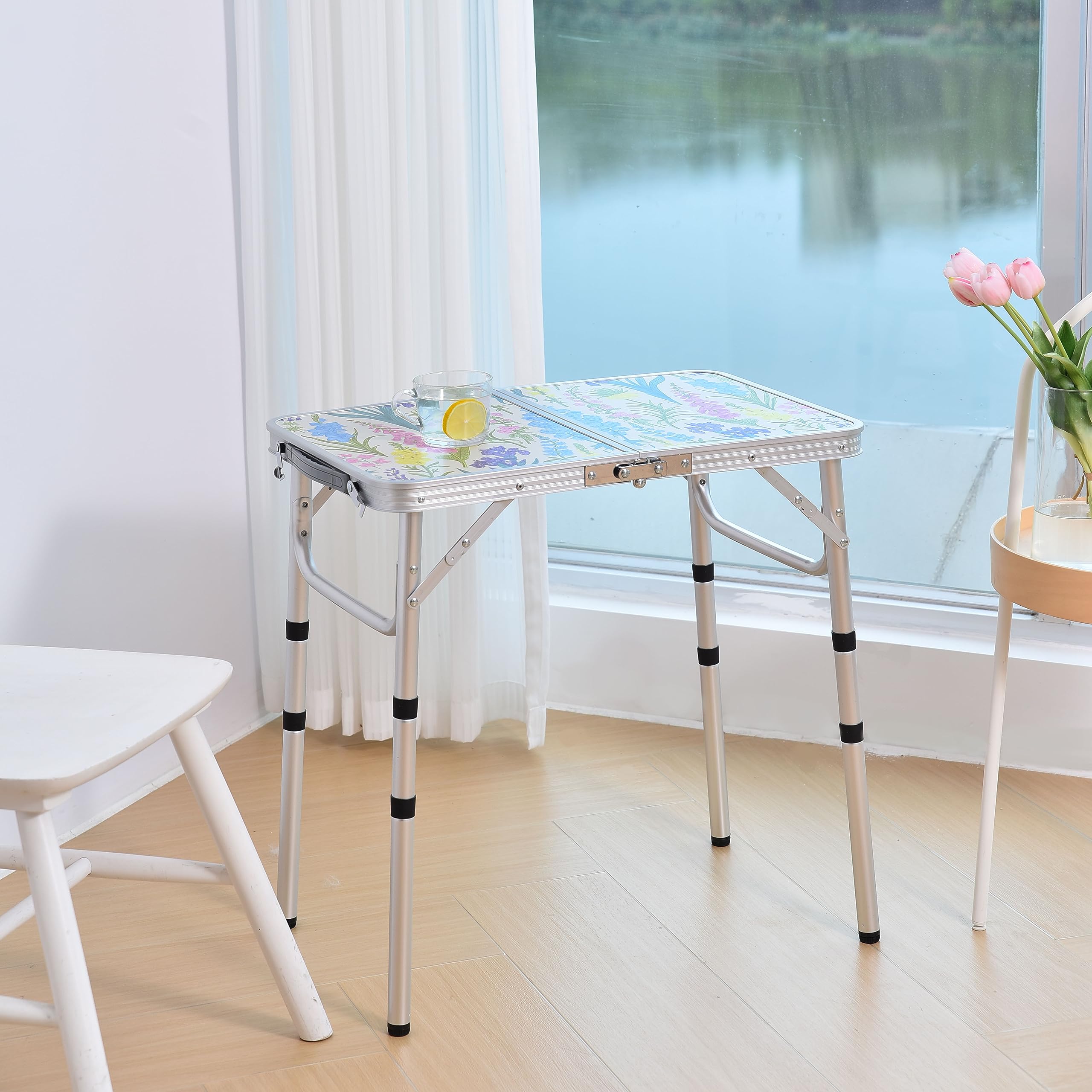 Yriuat folding camping table adjustable-height legs extended for versatile outdoor use.