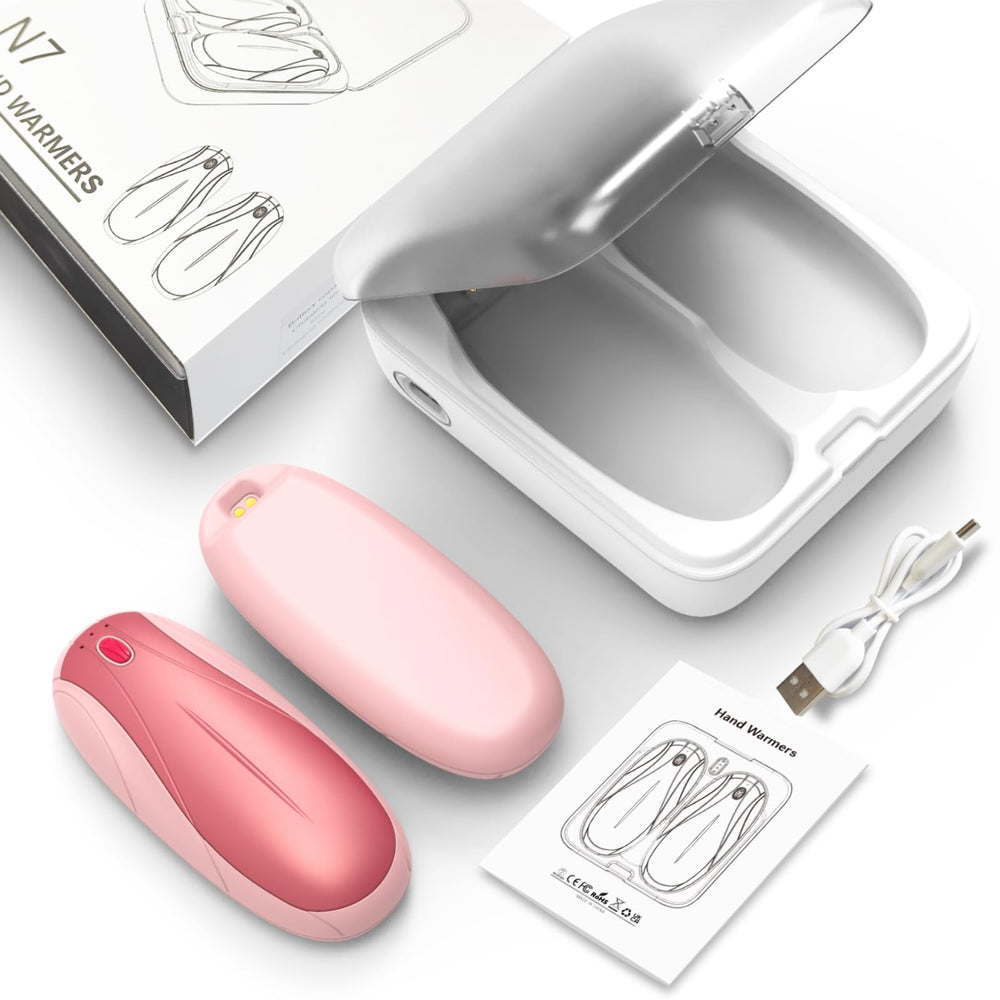 Yuegit pink hand warmers pictured in outdoor setup for camping warmth.