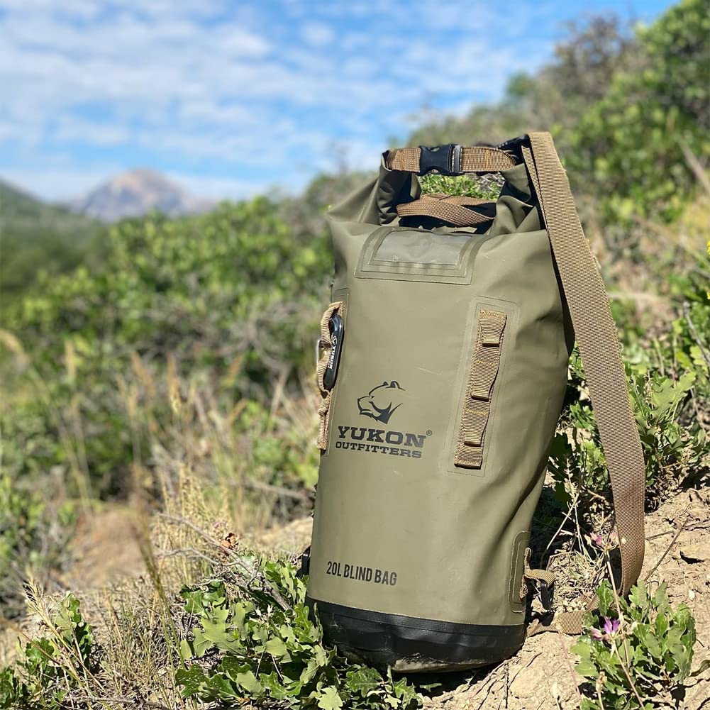 Yukon Outfitters 20L Blind Bag in field use near water for hunting setups