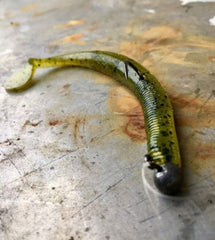 Yum Lures Swim'N Dinger paddle-tail design showing exaggerated side-to-side motion for bites.