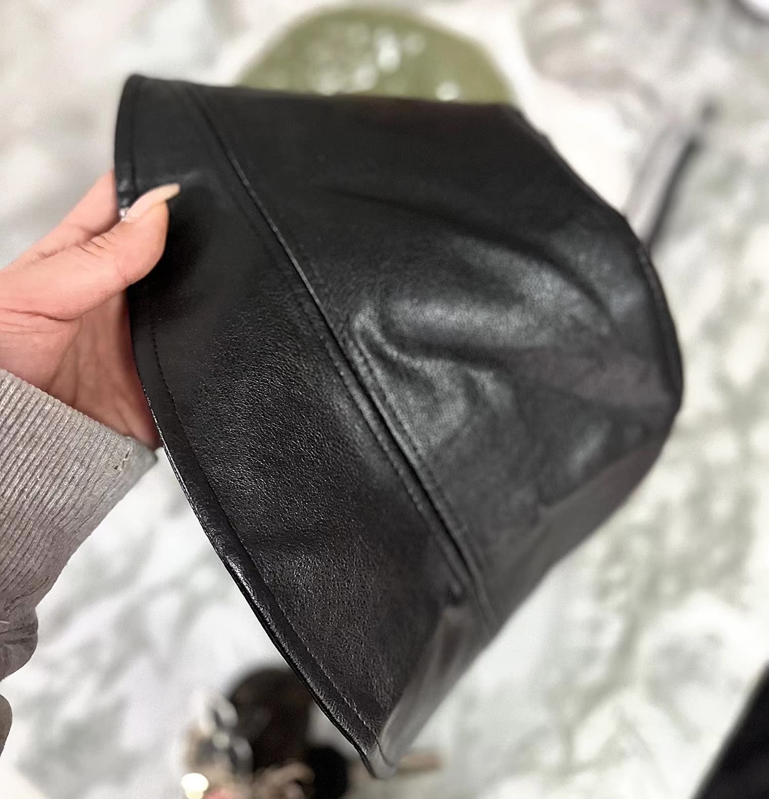 YY GEWETAO casual style leather bucket hat that complements outdoor outfits