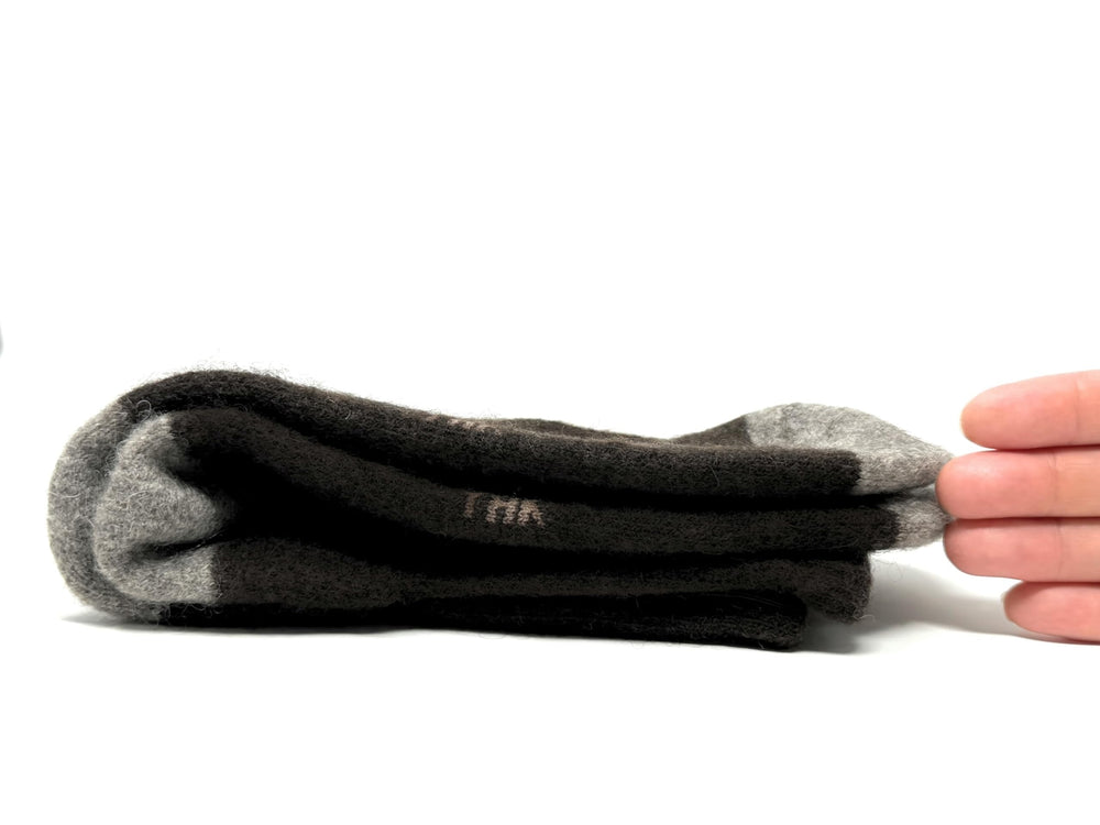 Zaya's Chic House model wearing yak down socks during a cozy lounge session