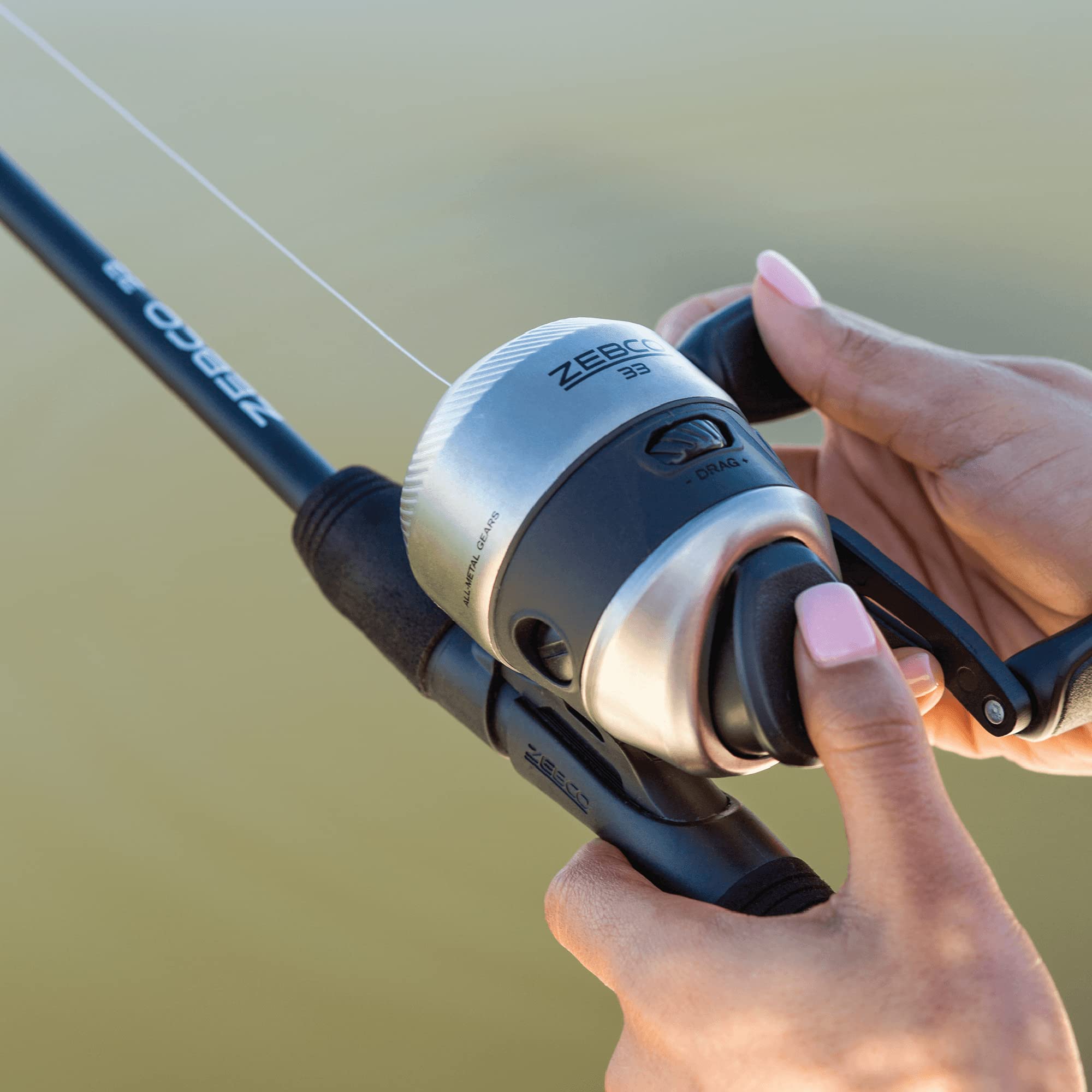 Zebco 33 Spincast reel in action, ready for panfish and bass setups.
