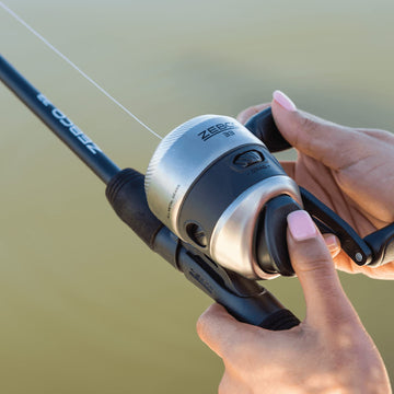 Zebco 33 Spincast reel in action, ready for panfish and bass setups.