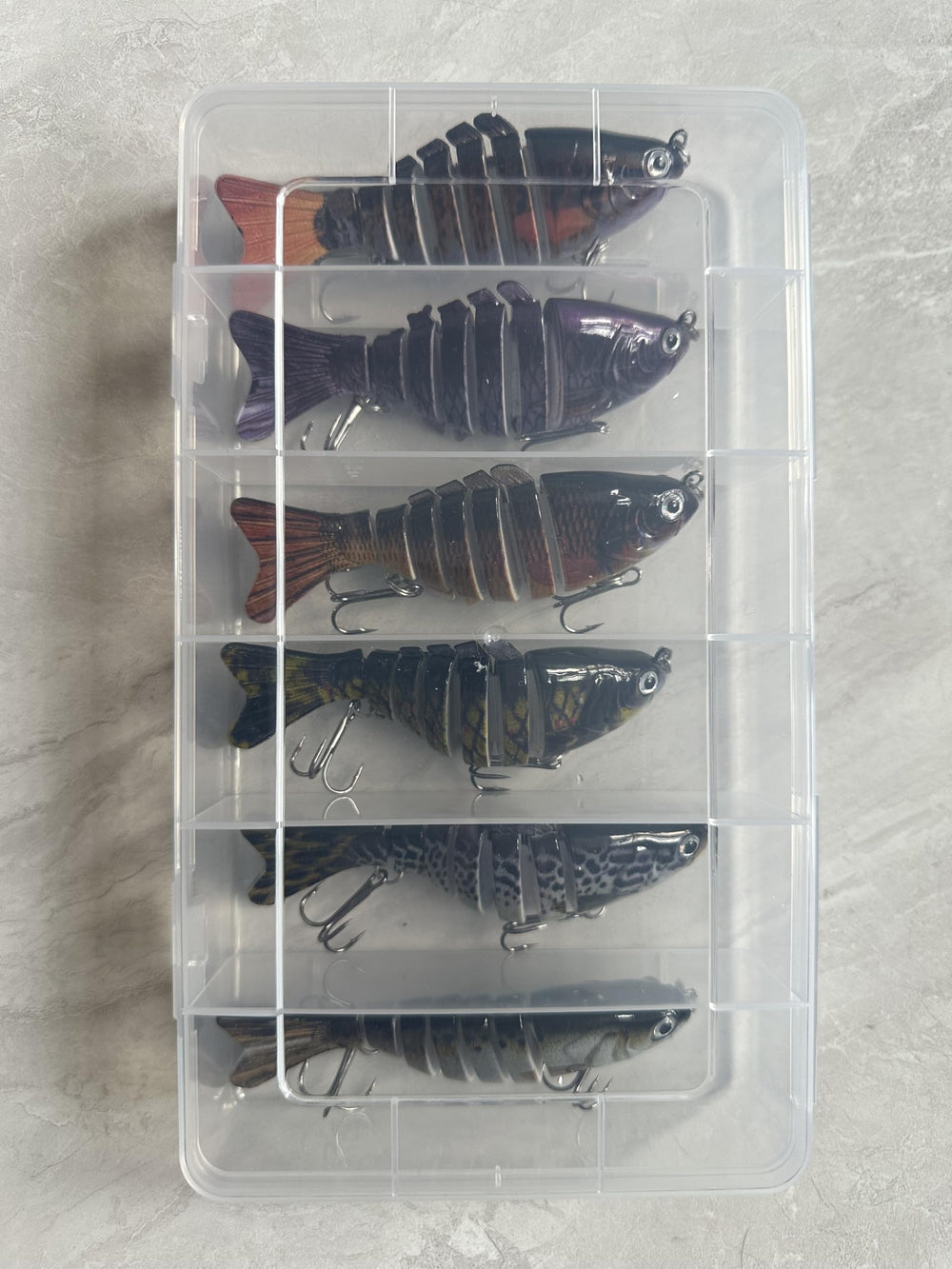 Plastic crush-resistant storage box included with lures