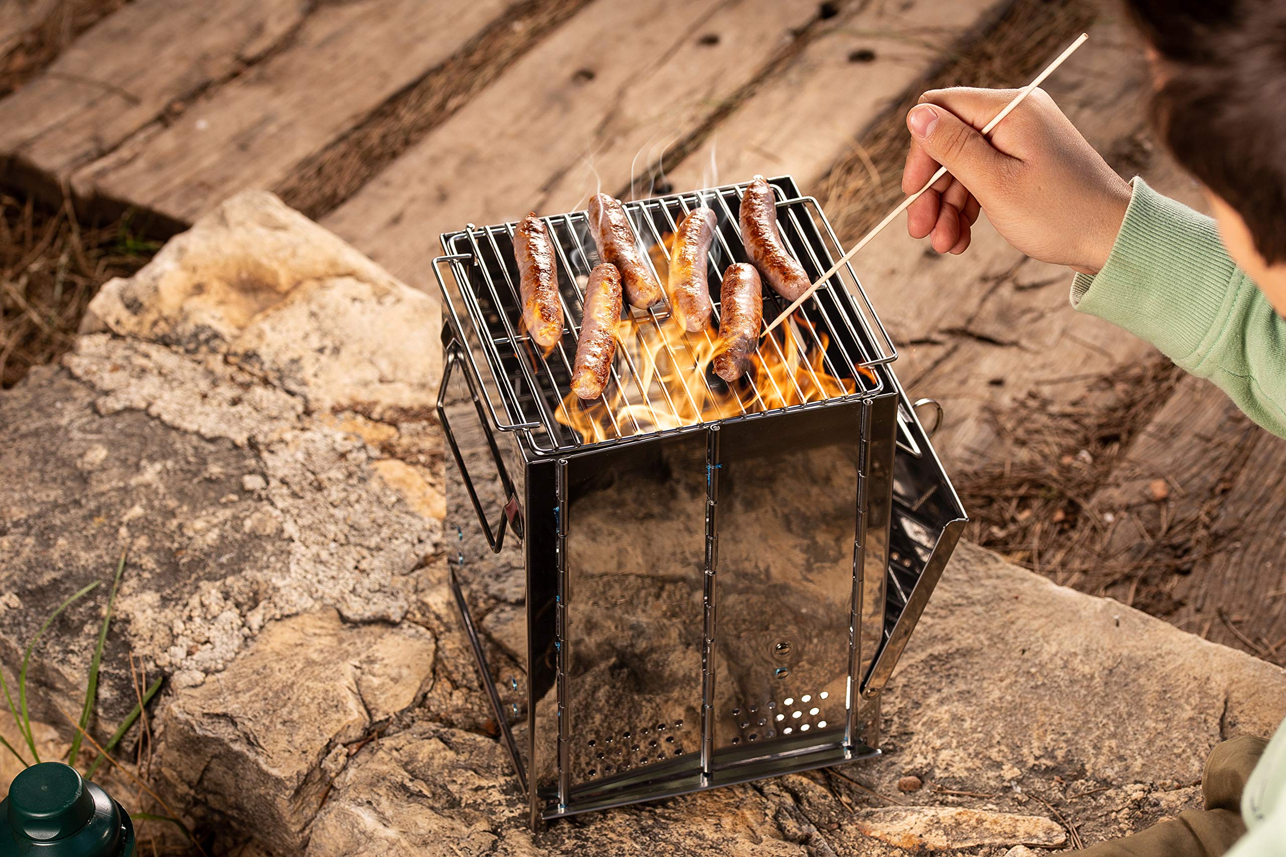 Zento Deals Camping Grill Large in-use-on-rock captures authentic outdoor cooking moments.