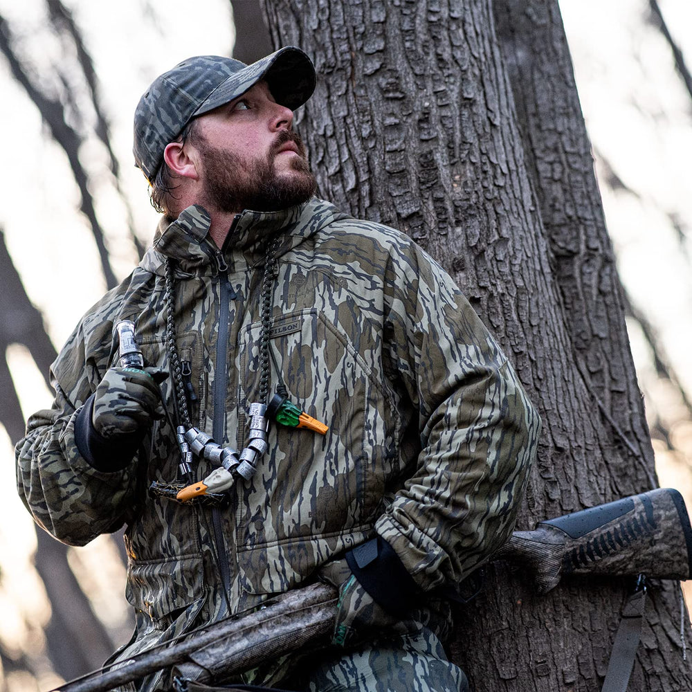 Zink Nothing But Green polycarbonate duck call hand-tune in field setting highlighting customizable sounds.