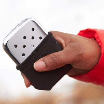 Zippo hand warmer 12-hour chrome silver packaging shows recyclable, refillable design.