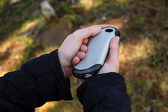 Zippo HeatBank 9s silhouette with winter gloves emphasizes pocket-friendly warmth