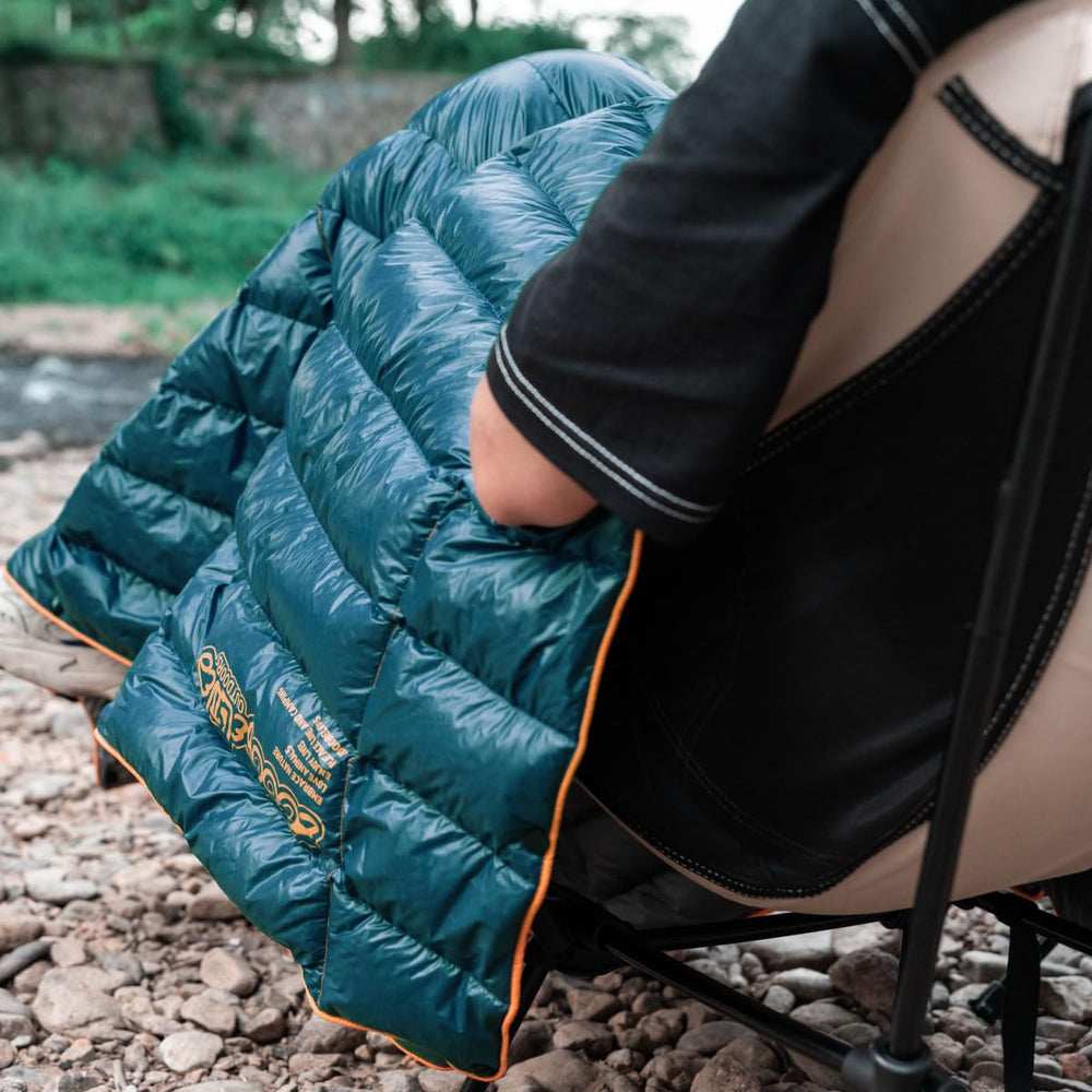 ZOOOBELIVES Ultralight Down Camping Blanket used in a hammock setup for layering