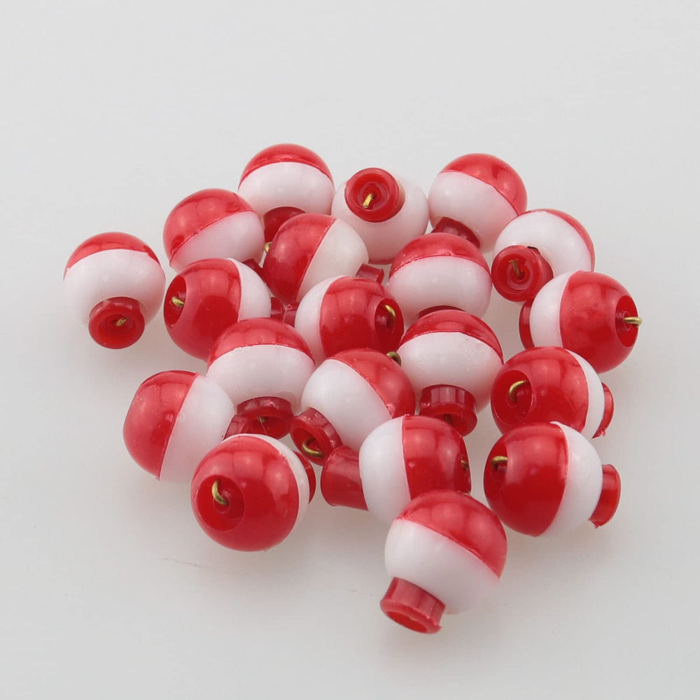Set includes multiple red and white bobbers for depth control
